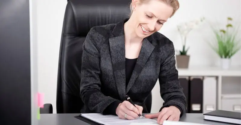 Happy office worker uses OCR for invoice processing - Artsyl