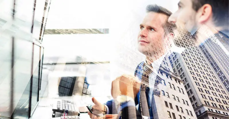 Businessmen examine working capital management as a way to improve cash flow - Artsyl